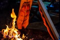 Fresh salmon grilled at an open fire place