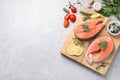 Fresh salmon and ingredients for marinade on light grey table, flat lay. Space for text Royalty Free Stock Photo