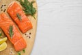 Fresh salmon and ingredients for marinade on white wooden table, top view. Space for text Royalty Free Stock Photo