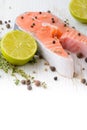 Fresh salmon with pepper, thyme and lime. Royalty Free Stock Photo
