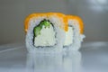 Fresh salmon philadelphia rolls. Smoked salmon rolls. Set of rolls on the board, table. One piece of roll. Food delivery, sushi. A