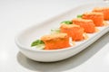 Fresh salmon roll in a white plate with selective focus Royalty Free Stock Photo