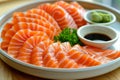 Fresh Salmon Sashimi Platter with Soy Sauce and Wasabi on Wooden Table Traditional Japanese Cuisine Royalty Free Stock Photo