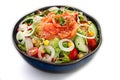 Fresh salmon sashimi salad with cherry tomatoes, cucumbers and lettuce greens isolated Royalty Free Stock Photo