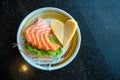 Fresh salmon slice and japanese omelette in heart shaped side dish by lettuce and radish. Royalty Free Stock Photo