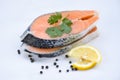 Fresh salmon steak with herbs and spices lemon on white plate background - Raw salmon fish fillet for cooked steak seafood Royalty Free Stock Photo