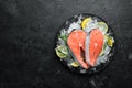 Fresh salmon steak on ice. Top view. Royalty Free Stock Photo