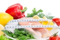 Fresh salmon steak for lunch with tape measure and salad tomatoes pepper lemon Royalty Free Stock Photo