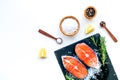 Fresh salmon steak with spices, rosemary, lemon for cooking healthy food on white background top view mock-up Royalty Free Stock Photo