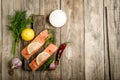 Fresh salmon steaks with herbs, lemon, rosemary and spices Royalty Free Stock Photo