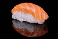 Fresh Salmon Sushi on black background. Nigiri or Sashimi Royalty Free Stock Photo