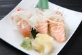 Fresh salmon sushi with chopped onoin