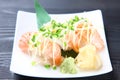 Fresh salmon sushi with chopped onoin