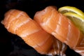 Fresh salmon sushi on dark background Royalty Free Stock Photo