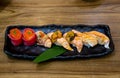 Fresh salmon sushi , salmon maki roll Japanese food restaurant, salmon sushi on plate. Sushi platter with a mixed variety of the Royalty Free Stock Photo