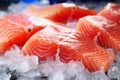 Fresh salmon or trout fish fillet on ice, ready for cooking. Storing fresh chilled fish. Close-up Royalty Free Stock Photo