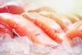 Fresh salmon or trout fish fillet on ice, ready for cooking. Storing fresh chilled fish. Close-up Royalty Free Stock Photo