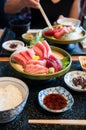 Fresh salmon, tuna, toro, maguro, otoro sashimi with wasabi on c