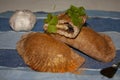 Fresh salted empanadas accompanied by the varnish brush and some ingredients such as garlic and parsley Royalty Free Stock Photo