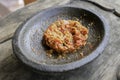 Fresh sambal served on stone mortar cobek. Sambal is traditional sauce from indonesia made from chili Royalty Free Stock Photo