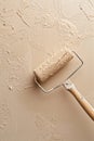Fresh Sand Beige Paint Application with Roller for Interior Wall Design and Renovation Projects Royalty Free Stock Photo