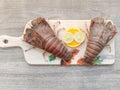 Fresh Sand Lobster or Flathead Lobster or Slipper Lobster decorated with herbs and vegetables .Selective focus Royalty Free Stock Photo