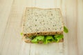 Fresh sandwich made from wholewheat of various seeds and multigrain in wood background. Royalty Free Stock Photo