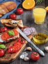 Fresh sandwiches baguette , tomatoes, vegetables and olive oil, ingredients for making a vegan sandwich, close-up. Freshly squeeze Royalty Free Stock Photo