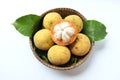 Close up fresh sliced santol Sandoricum koetjape fruit in a Wicker basket.the famous fruit Thailand and seasonal fruit