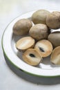 Fresh Sapodilla fruit carving on the plate. Royalty Free Stock Photo