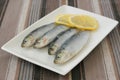 Fresh sardines with lemon Royalty Free Stock Photo