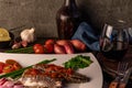 Fresh sardines with tomato sauce and other vegetables