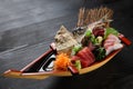 Studio shot of sashimi boat on black background Royalty Free Stock Photo