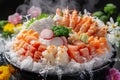 Fresh Sashimi Platter with Shrimp, Salmon, Tuna, and Crab on Ice with Flowers for Elegant Japanese Cuisine Royalty Free Stock Photo