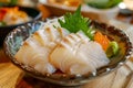 Fresh Sashimi Platter with Tender Slices of White Fish, Salmon, and Garnishes Served in a Stylish Japanese Restaurant Royalty Free Stock Photo