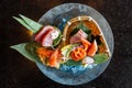 Fresh sashimi set including Blue Fin Tuna, Hamachi, Crab stick served with wasabi and sliced lemon Royalty Free Stock Photo