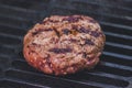 Fresh sausage and hot dogs grilling outdoors on a gas barbecue grill. Royalty Free Stock Photo