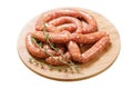 Fresh sausages on a board isolated on white background Royalty Free Stock Photo