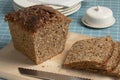 Fresh Scandinavian loaf and slices of sourdough spelt bread close up on a cutting board