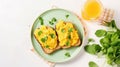 Fresh scrambled eggs on toast with microgreens and a glass of orange juice on a light background Royalty Free Stock Photo