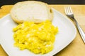 Fresh scrambled eggs on a white plate. Royalty Free Stock Photo