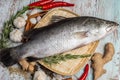 Fresh Sea Bass on rattan plate and wooden background Royalty Free Stock Photo