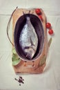 Fresh sea bream fish in a stewing dish Royalty Free Stock Photo