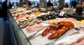 Fresh seafood display featuring a variety of fish, shellfish, and crustaceans on ice, showcasing vibrant colors and textures in a Royalty Free Stock Photo