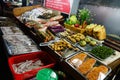 Fresh, Seafood, Filled, Salt-fish, Bread, Green Peppers, Vegetables Set for Sale displayed On the Counter, Street Market on Night Royalty Free Stock Photo