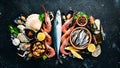 Fresh seafood on a stone background. Fish, shrimp, mussels, caviar. Royalty Free Stock Photo