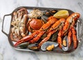 Fresh seafood on a tray: spider crab, crayfish and mussels