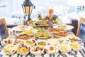 Seafoods, fish, salad and mezes on the table near the sea Royalty Free Stock Photo