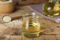 Fresh sesame oil and seeds on wooden rustic table Royalty Free Stock Photo