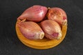 Fresh shallot on grey stone